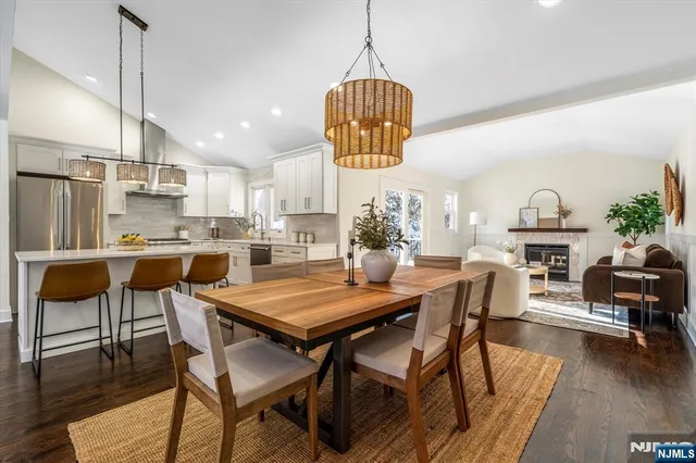 a living room with furniture a window and a fireplace