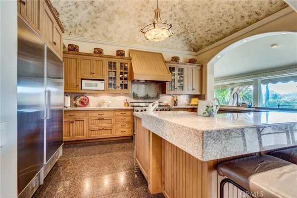 a kitchen with cabinets and outdoor view