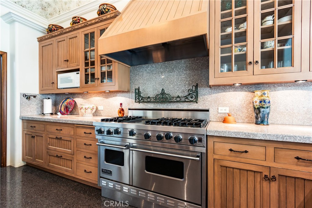 39250 Ortega Highway Fallbrook, CA 92028 - Photo 15 of 59 a kitchen with stainless steel appliances granite countertop a stove and a sink