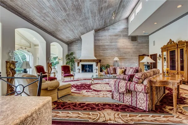 a view of a livingroom with furniture wooden floor a chandelier