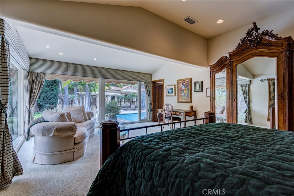 39250 Ortega Highway Fallbrook, CA 92028 - Photo 27 of 59 a bedroom with a bed and glass windows