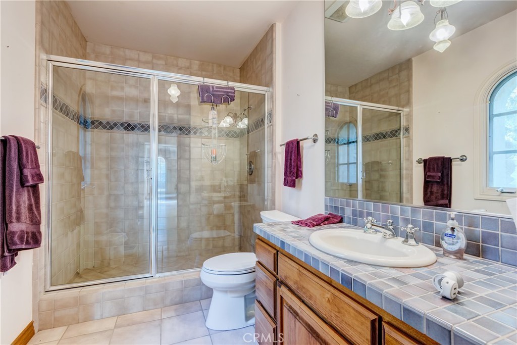 39250 Ortega Highway Fallbrook, CA 92028 - Photo 49 of 59 a bathroom with a granite countertop sink toilet and shower