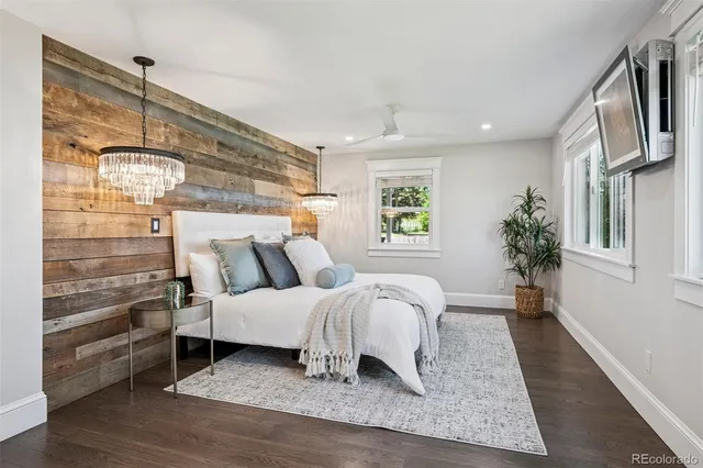 a living room with a bed furniture and a window