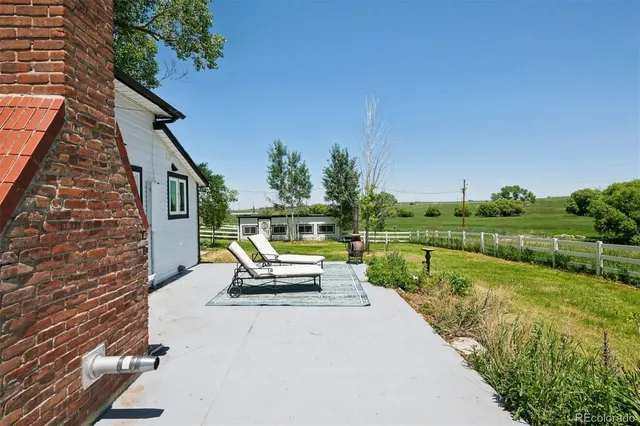 a view of swimming pool with a patio