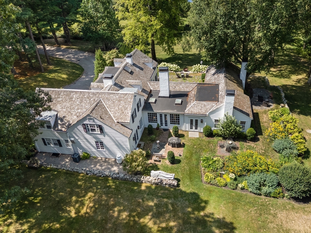 an aerial view of a house with a garden