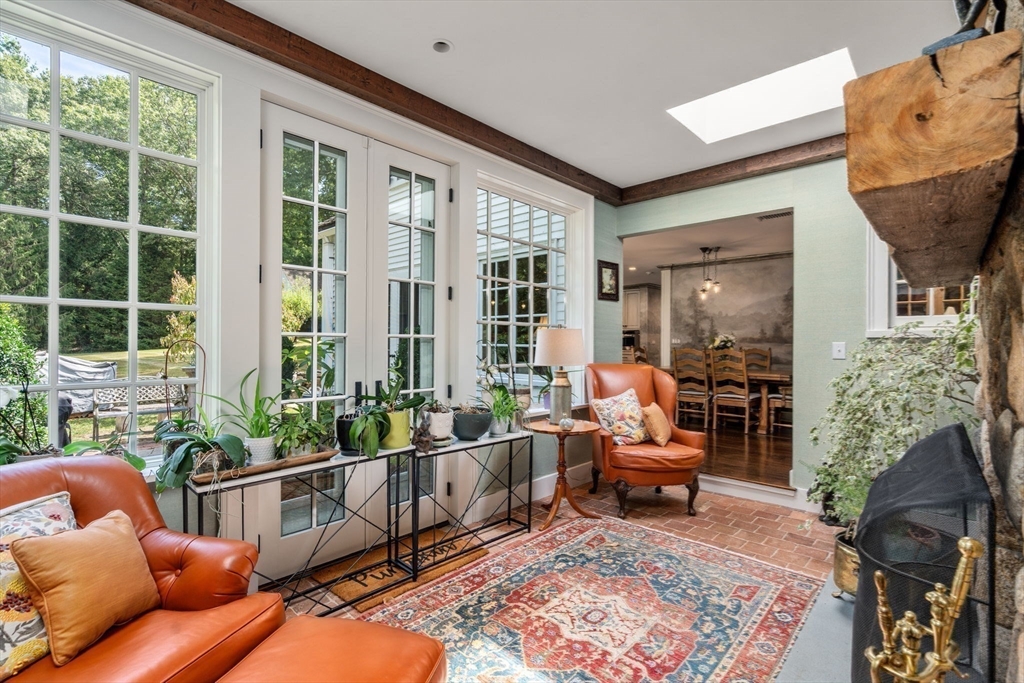 157 Centre Street Dover, MA 02030 - Photo 14 of 42 a living room filled with furniture hardwood floor and a floor to ceiling window