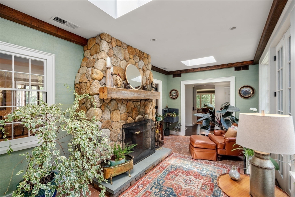 157 Centre Street Dover, MA 02030 - Photo 15 of 42 a living room with fireplace furniture and a potted plant