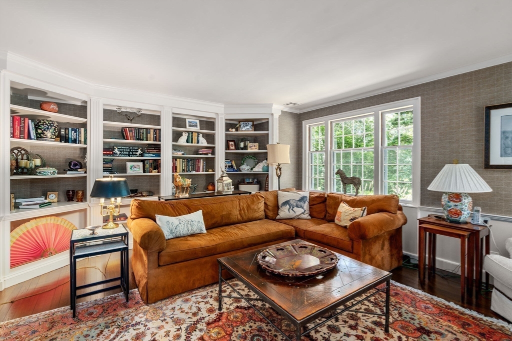 157 Centre Street Dover, MA 02030 - Photo 20 of 42 a living room with furniture and a book shelf