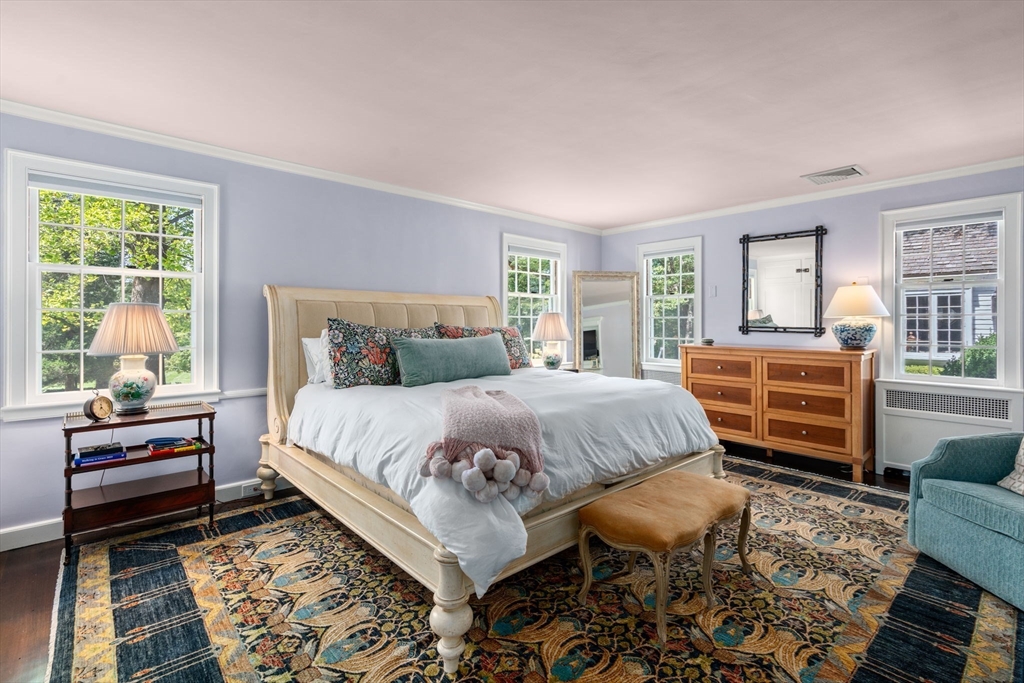 157 Centre Street Dover, MA 02030 - Photo 23 of 42 a bedroom with a bed and wooden floor