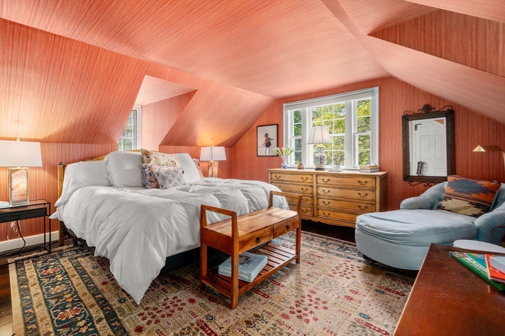 157 Centre Street Dover, MA 02030 - Photo 27 of 42 a spacious bedroom with a bed and a couch