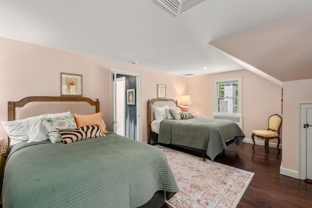 157 Centre Street Dover, MA 02030 - Photo 28 of 42 a bedroom with a bed and wooden floor