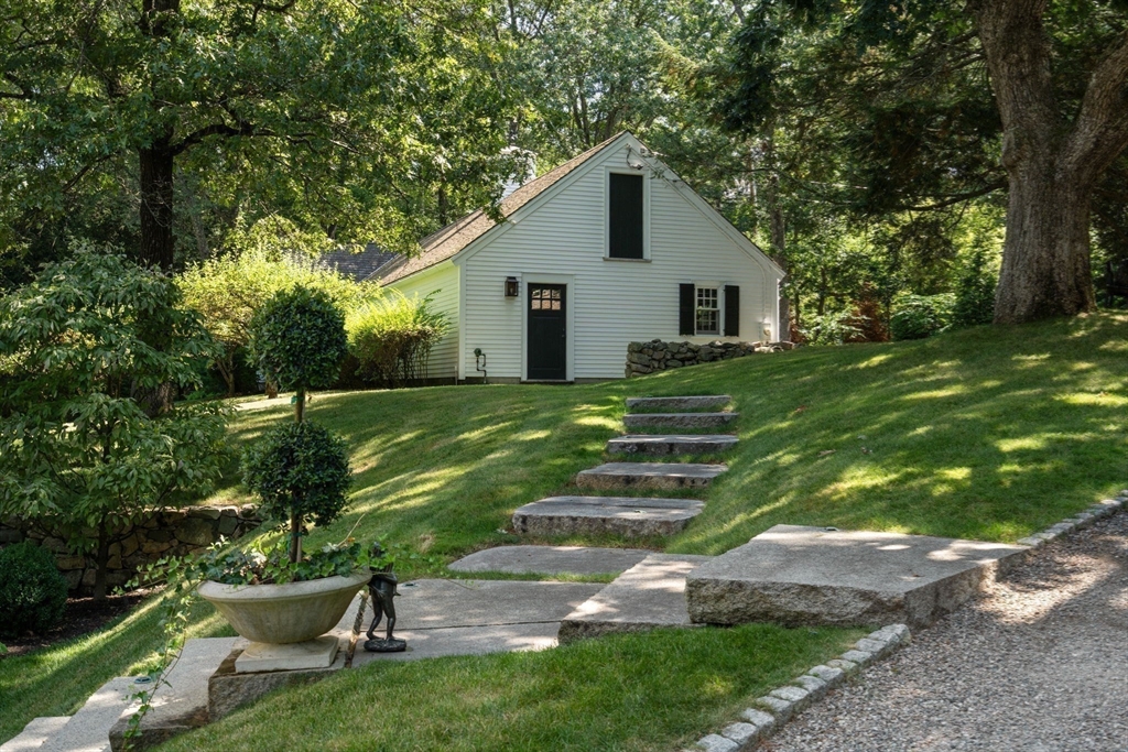 157 Centre Street Dover, MA 02030 - Photo 31 of 42 a house view with a garden space