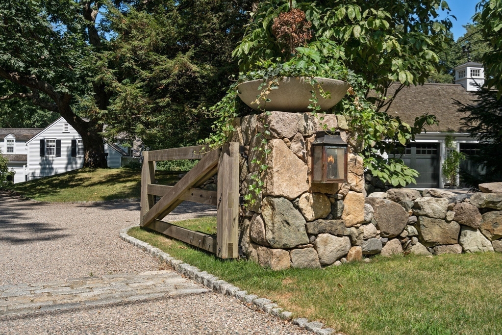 157 Centre Street Dover, MA 02030 - Photo 41 of 42 a front view of a house with a yard and large trees