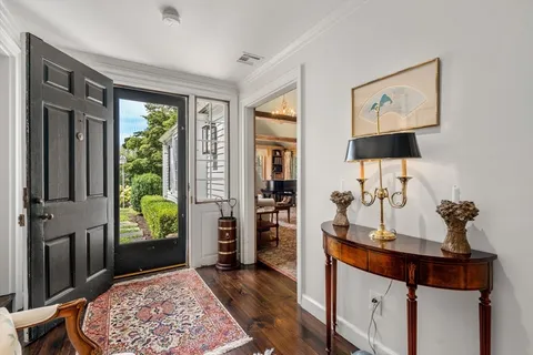 a view of room with window and hallway