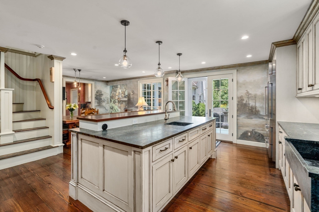 157 Centre Street Dover, MA 02030 - Photo 9 of 42 a kitchen with stainless steel appliances granite countertop a kitchen island a stove a sink and a refrigerator