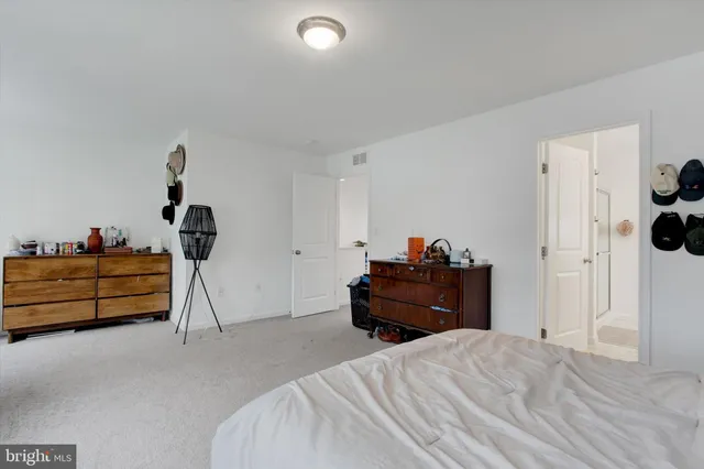 a bed room with a bed and a window