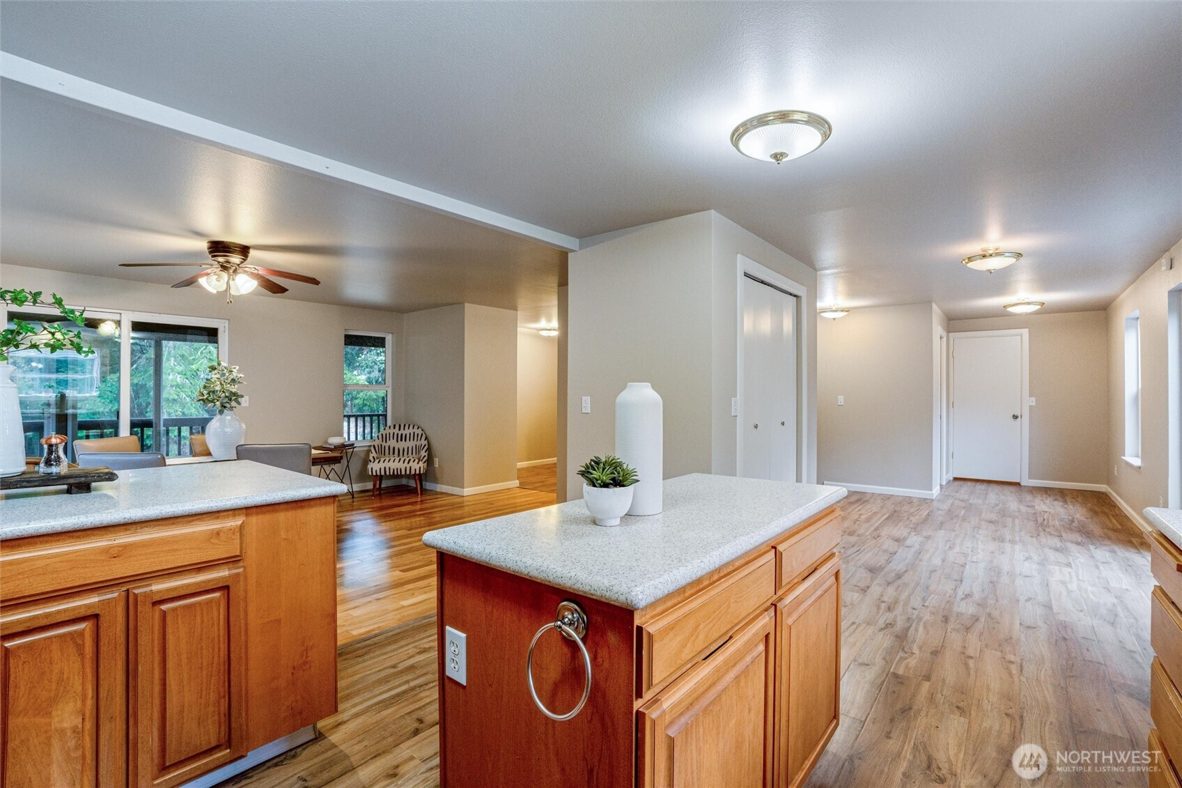 5735 Southeast Alpine Road Olalla, WA 98359 - Photo 11 of 40 a view of a kitchen island a chandelier and living room