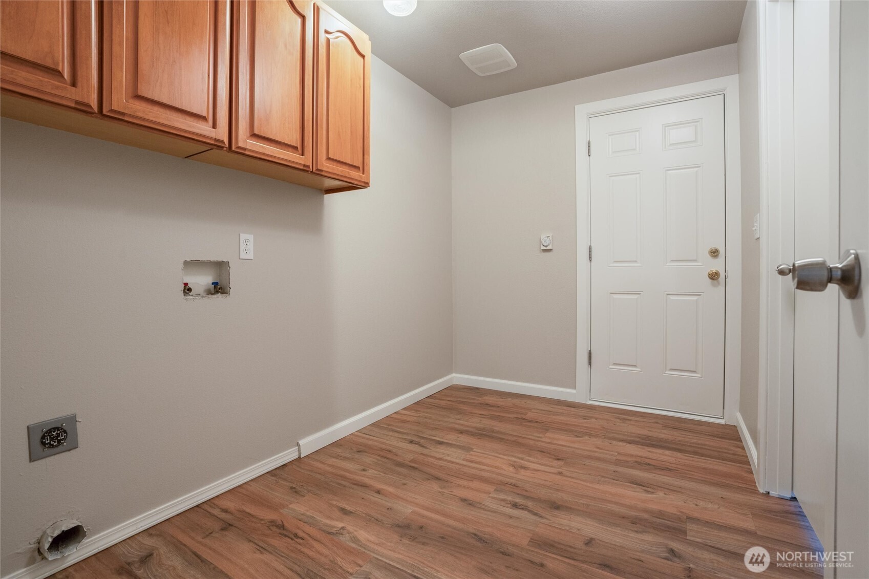 5735 Southeast Alpine Road Olalla, WA 98359 - Photo 14 of 40 a view of an empty room with wooden floor