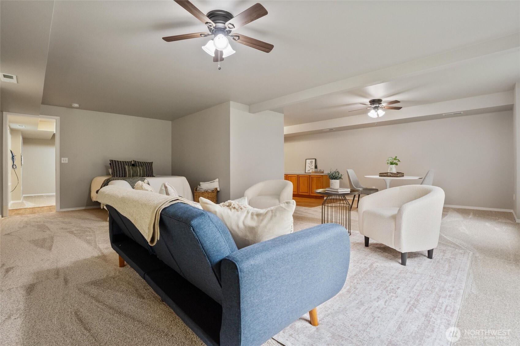 5735 Southeast Alpine Road Olalla, WA 98359 - Photo 16 of 40 a bedroom with bed and a chandelier