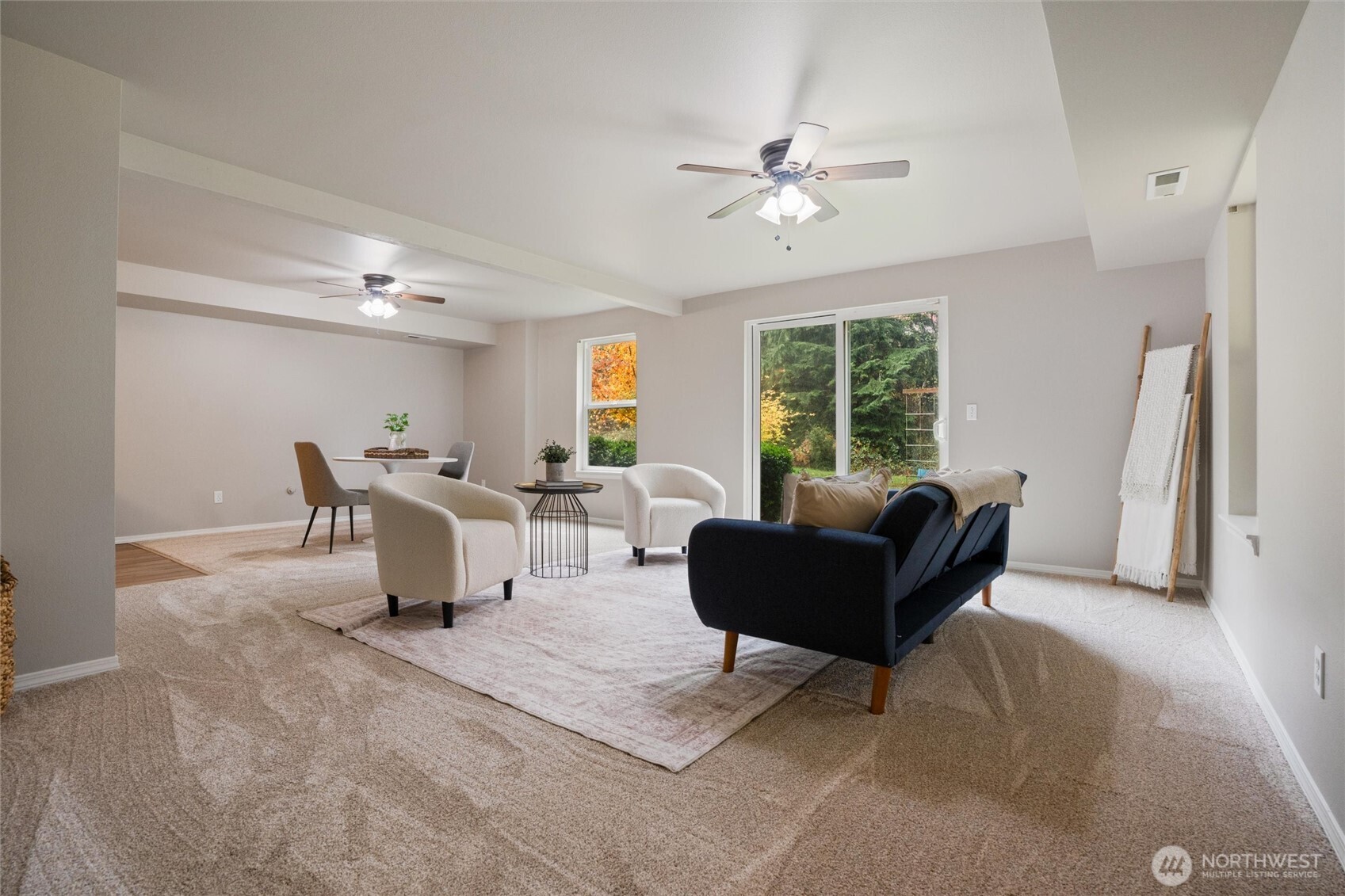 5735 Southeast Alpine Road Olalla, WA 98359 - Photo 17 of 40 a living room with furniture and a large window