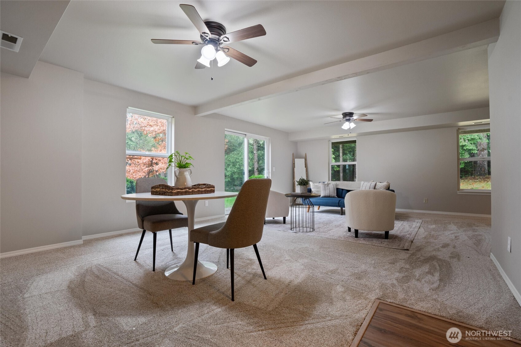 5735 Southeast Alpine Road Olalla, WA 98359 - Photo 18 of 40 a living room with furniture a chandelier and a window