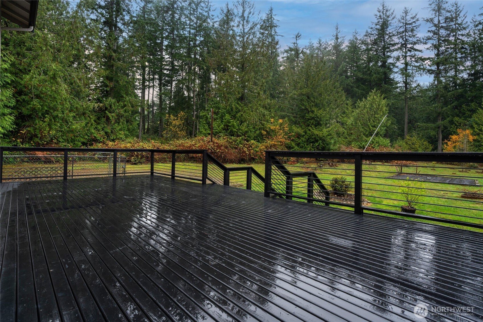 5735 Southeast Alpine Road Olalla, WA 98359 - Photo 32 of 40 a view of a terrace with wooden floor and bench