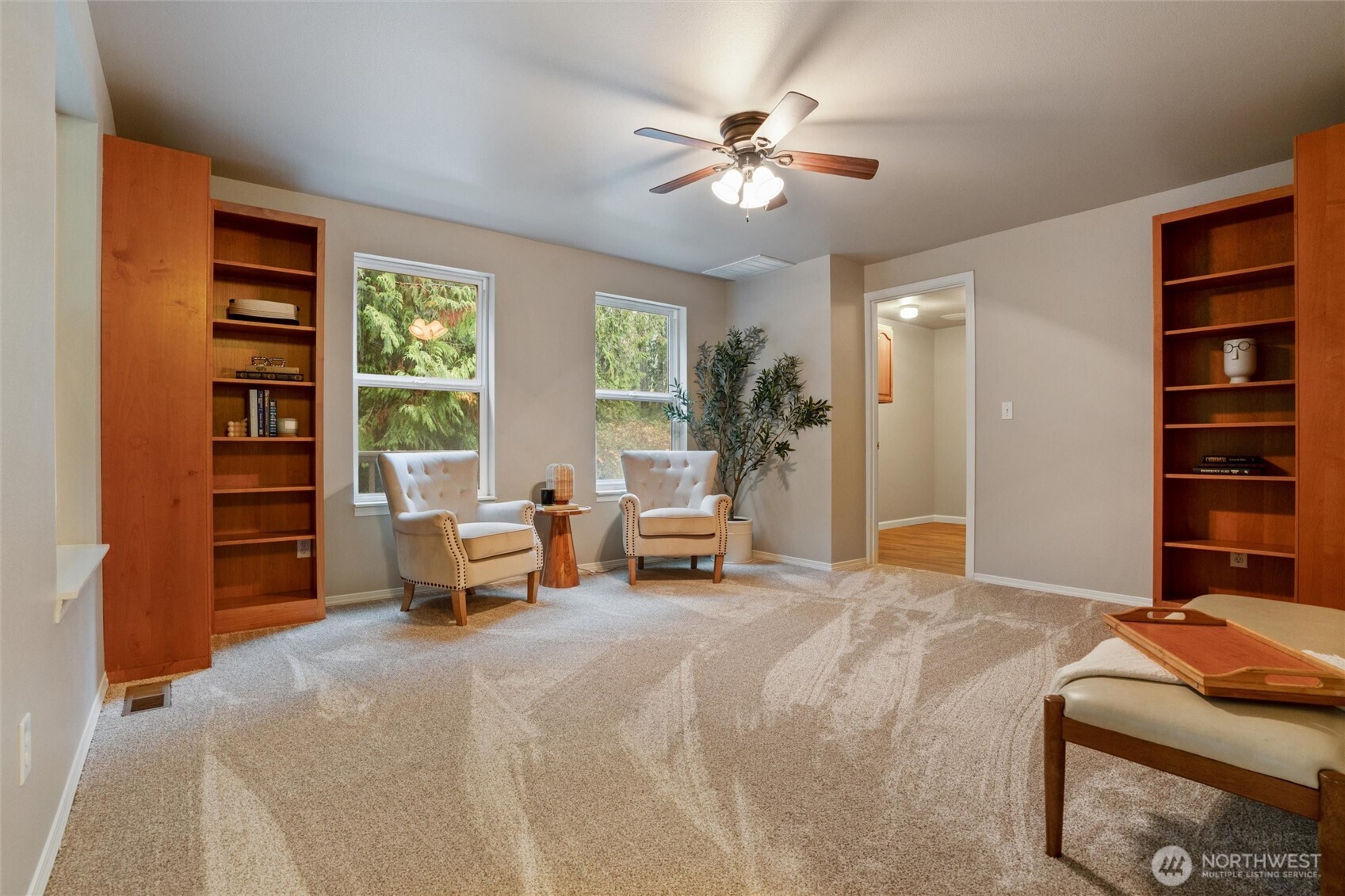 5735 Southeast Alpine Road Olalla, WA 98359 - Photo 4 of 40 a bedroom with a large bed and a chandelier