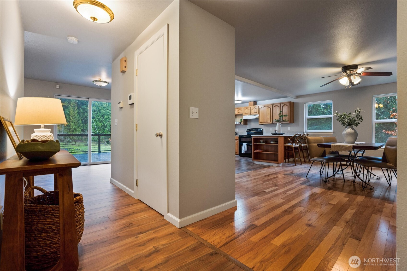 5735 Southeast Alpine Road Olalla, WA 98359 - Photo 5 of 40 a view of a livingroom and dining room with furniture wooden floor