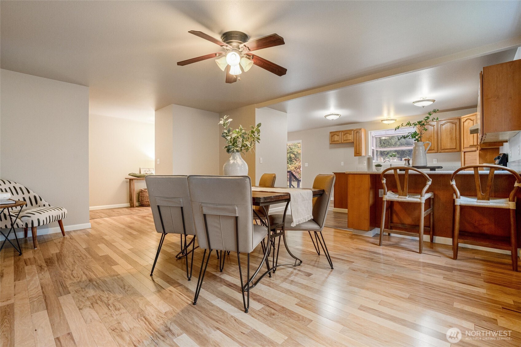 5735 Southeast Alpine Road Olalla, WA 98359 - Photo 7 of 40 a view of a dining room with furniture and wooden floor