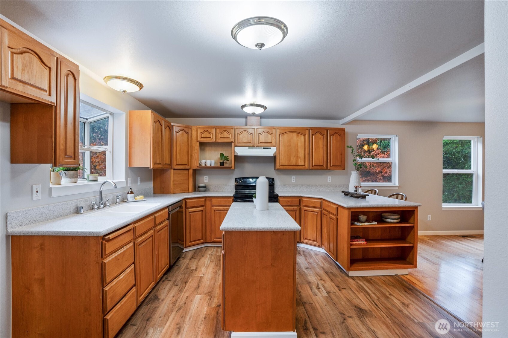 5735 Southeast Alpine Road Olalla, WA 98359 - Photo 9 of 40 a kitchen with stainless steel appliances granite countertop a stove and a sink
