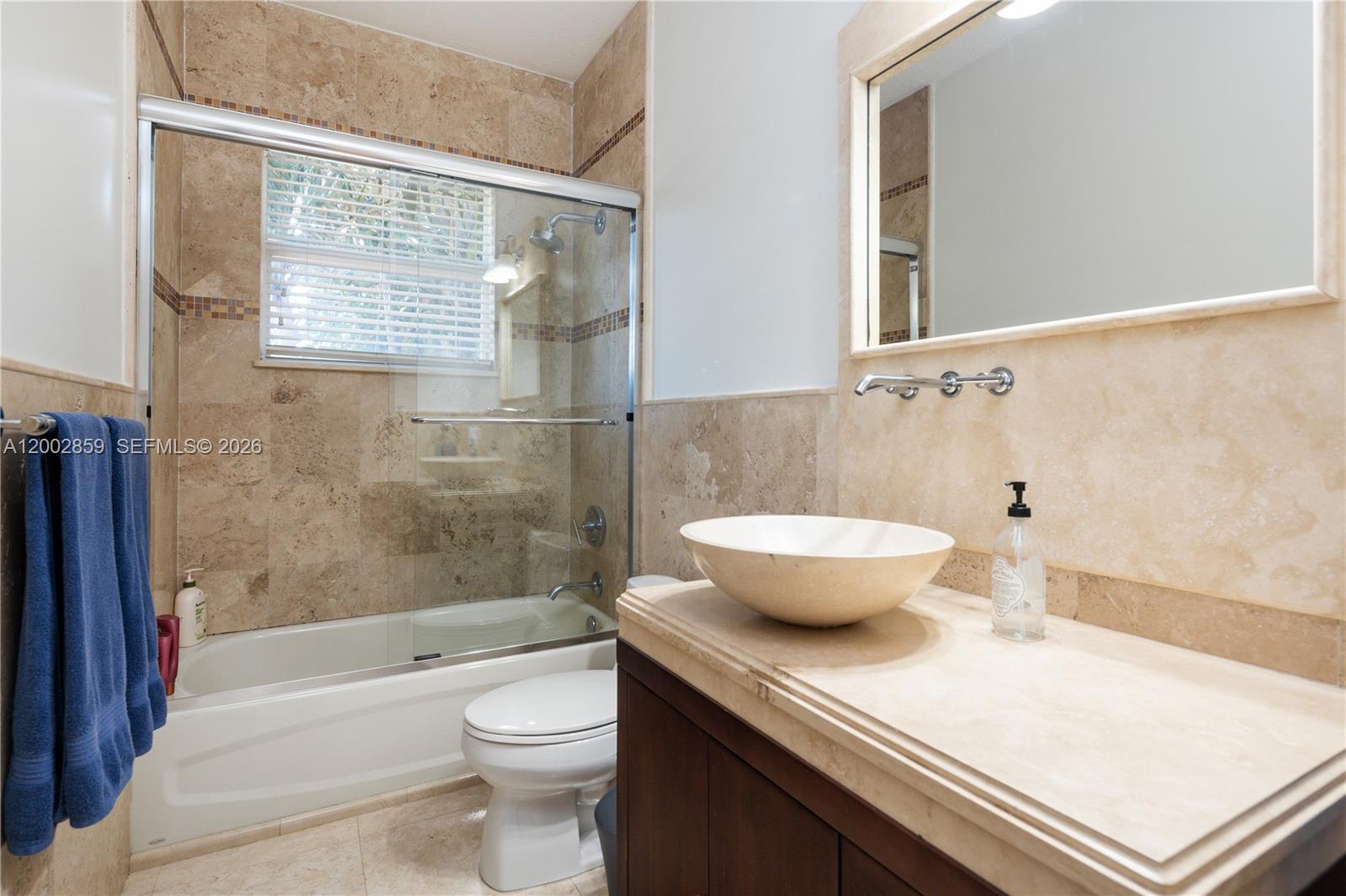3171 Indiana Street, Unit 3171 Miami, FL 33133 - Photo 9 of 14 a bathroom with a sink a toilet and shower