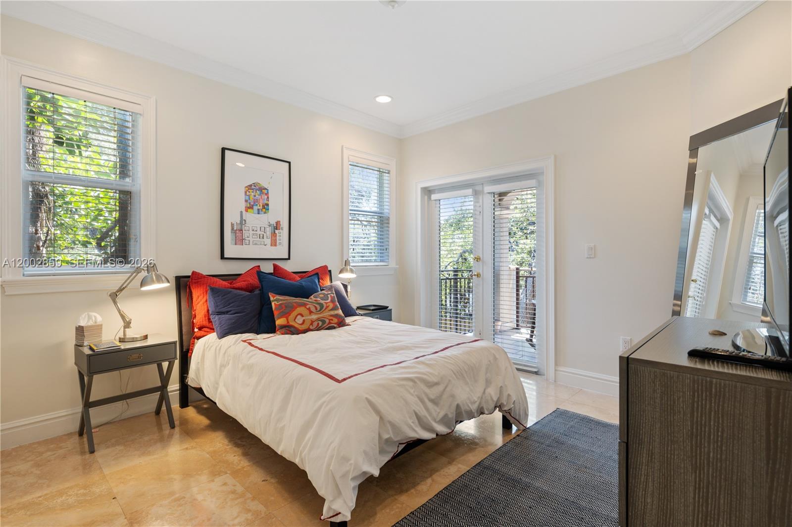 3171 Indiana Street, Unit 3171 Miami, FL 33133 - Photo 10 of 14 a bedroom with a bed and a flat screen tv