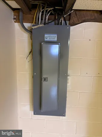 a view of a garage with a bike and white roof