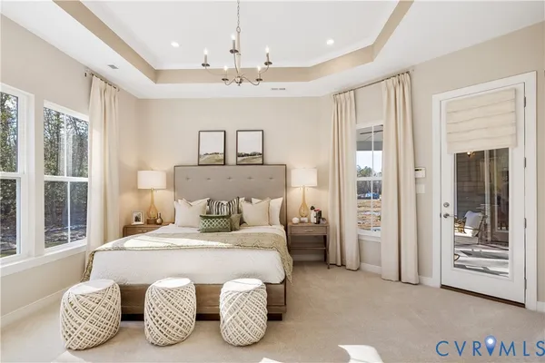 a bedroom with a bed and ceiling fan