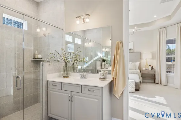 a bathroom with a sink vanity and mirror