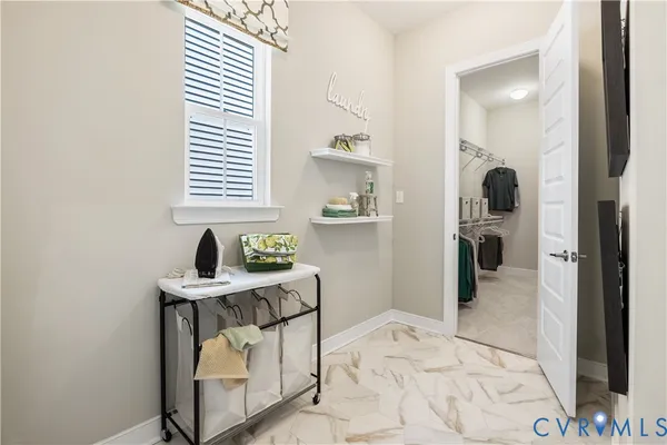 a bedroom with a bed and a window in it