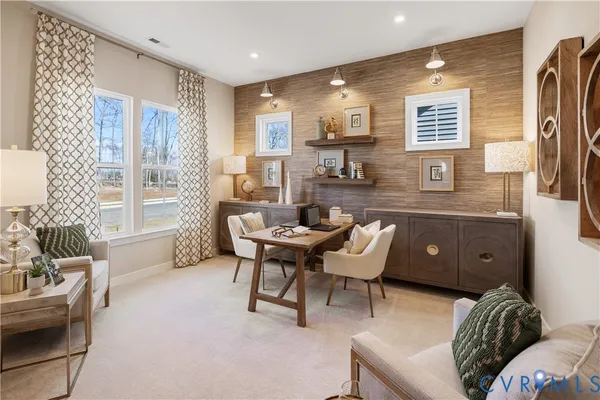 a dining room with furniture and window
