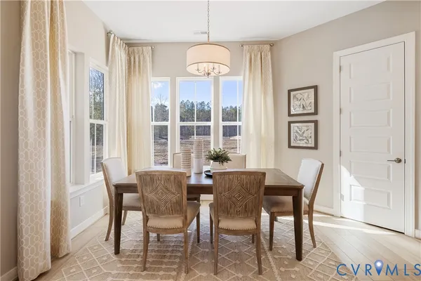 a view of a dining room with furniture window and outside view