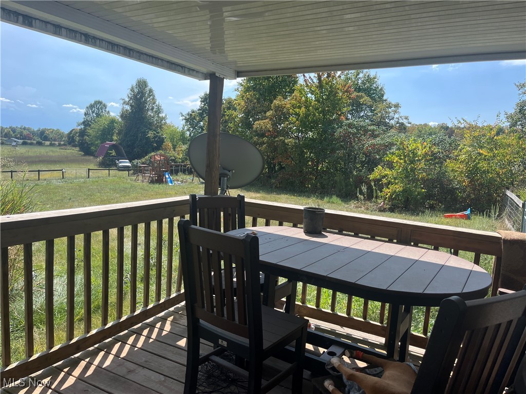 76303 Science Hill Road Kimbolton, OH 43749 - Photo 7 of 18 Wooden terrace with a playground and a yard