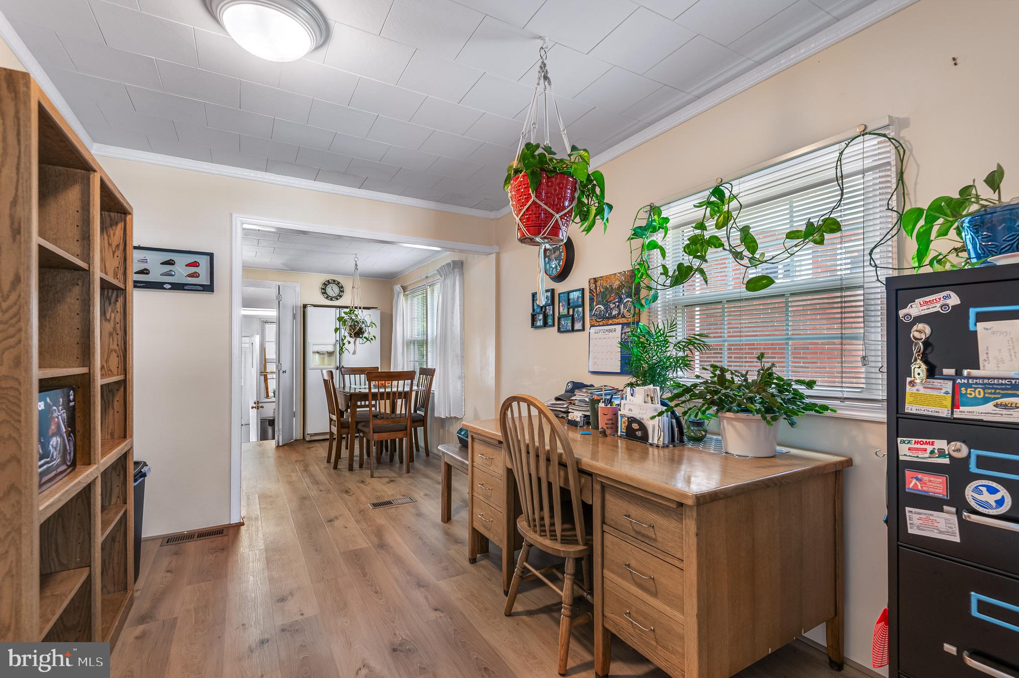 111 Compass Road Baltimore, MD 21220 - Photo 12 of 36 a living room with furniture and a chandelier