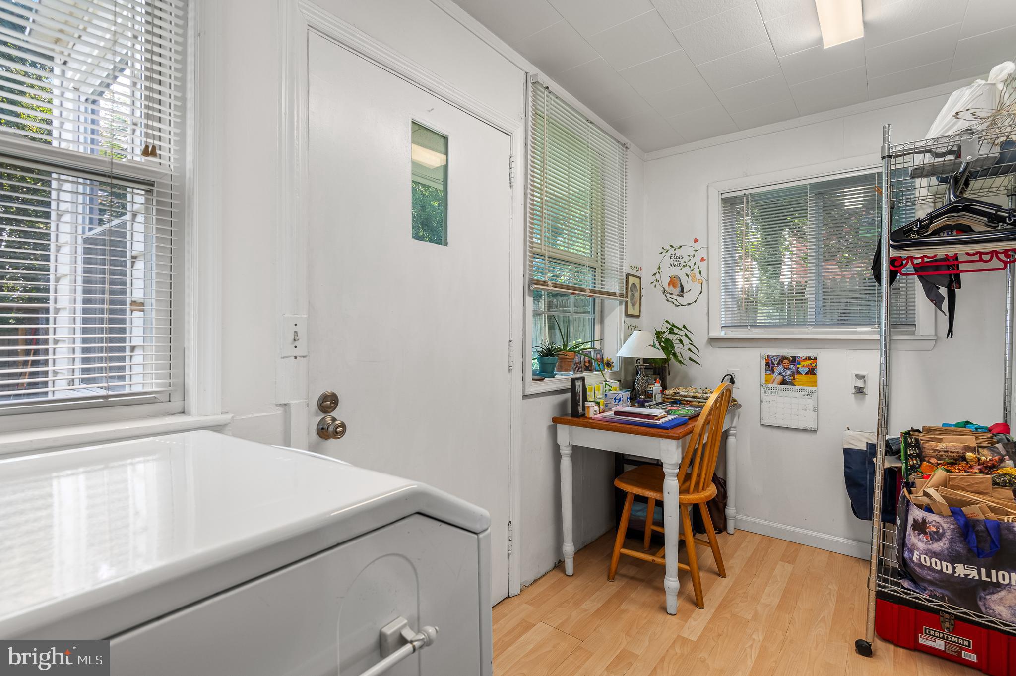 111 Compass Road Baltimore, MD 21220 - Photo 20 of 36 a room with furniture a piano and a window
