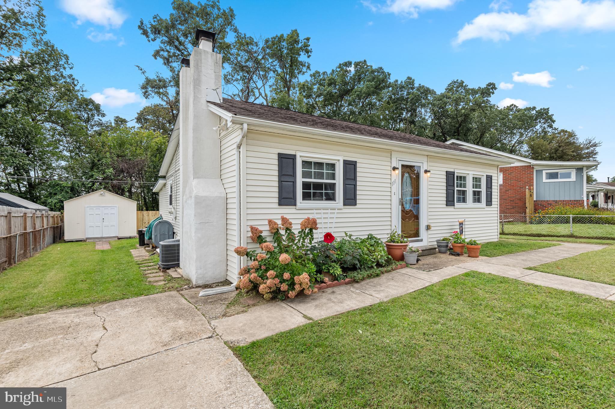 111 Compass Road Baltimore, MD 21220 - Photo 2 of 36 a front view of a house with garden
