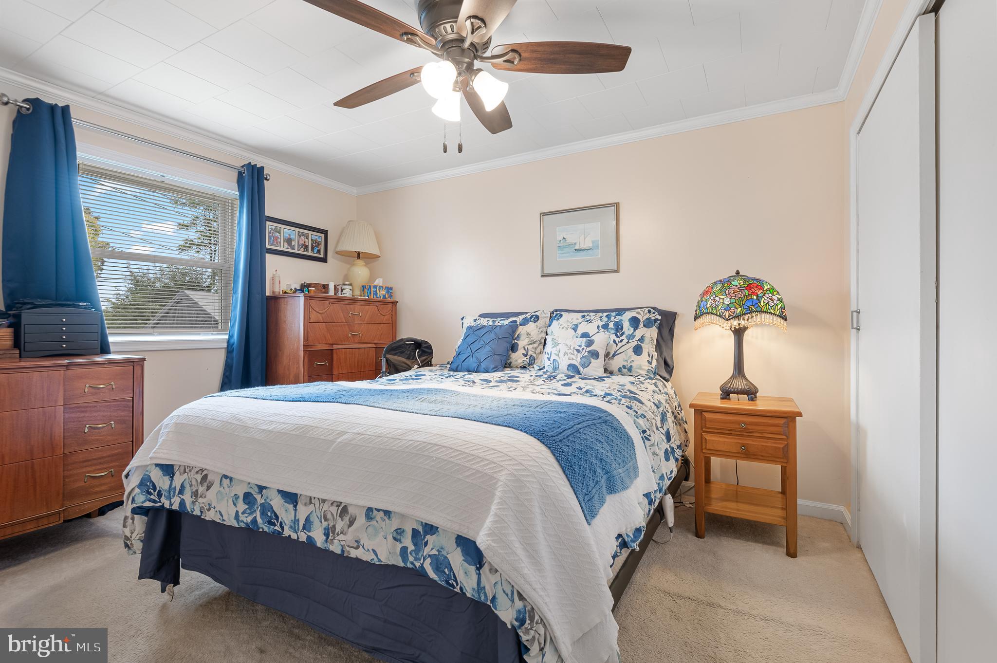 111 Compass Road Baltimore, MD 21220 - Photo 27 of 36 a bedroom with a bed and a chandelier