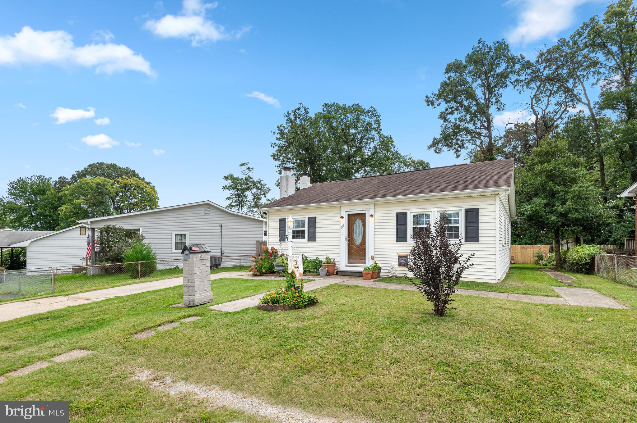 111 Compass Road Baltimore, MD 21220 - Photo 3 of 36 a house view with a sitting space and garden