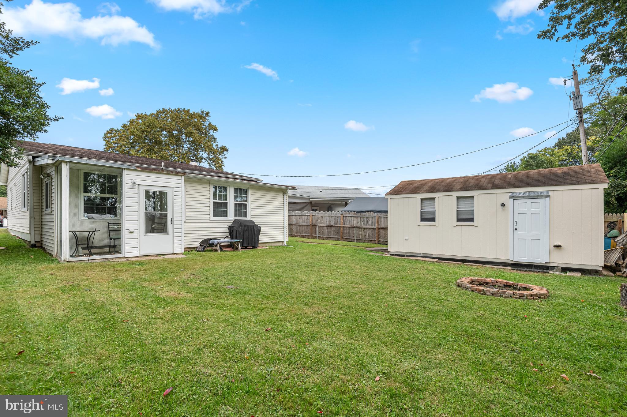 111 Compass Road Baltimore, MD 21220 - Photo 32 of 36 a backyard of a house with table and chairs