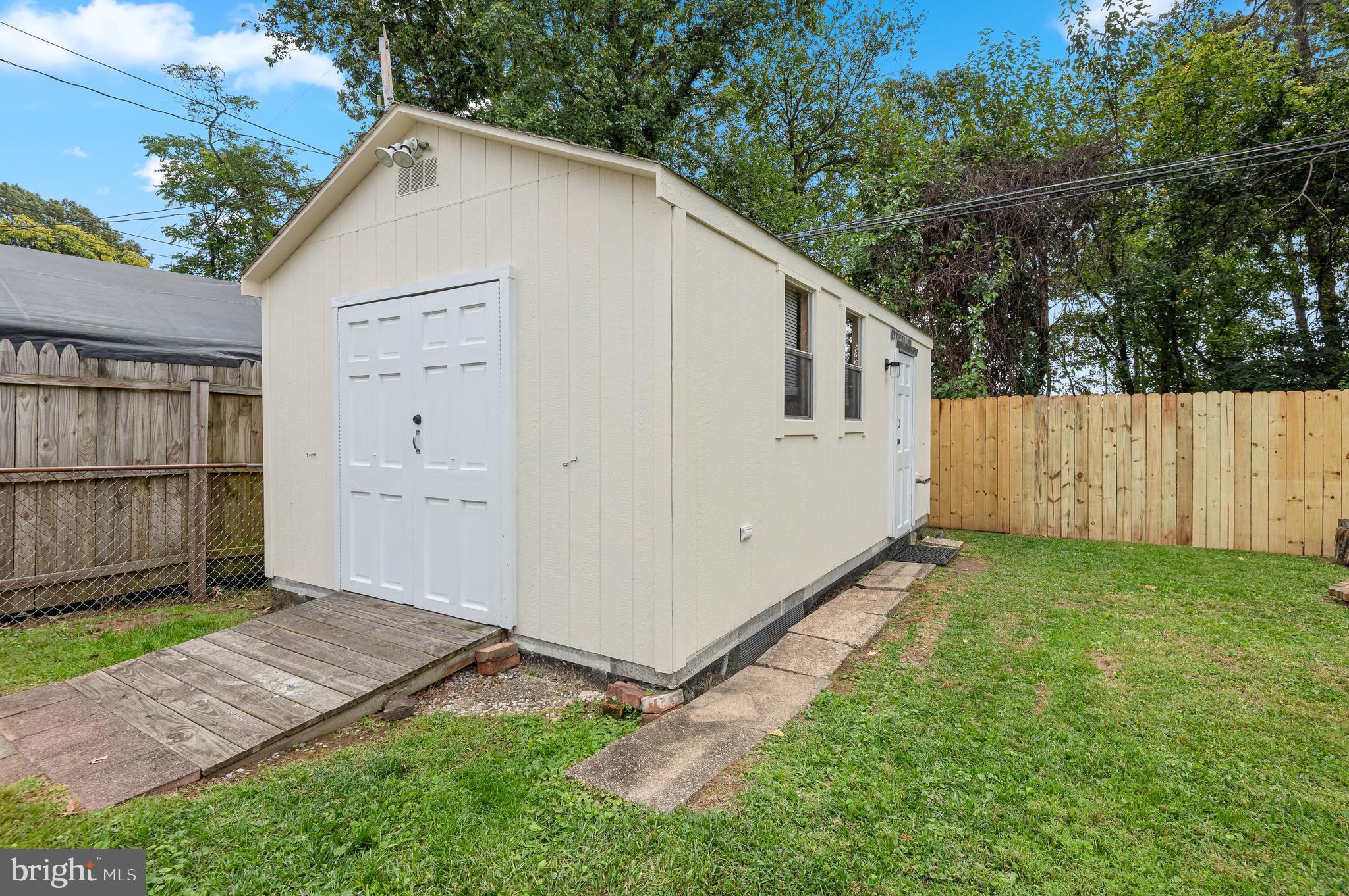 111 Compass Road Baltimore, MD 21220 - Photo 33 of 36 a view of backyard with small cabin and wooden fence