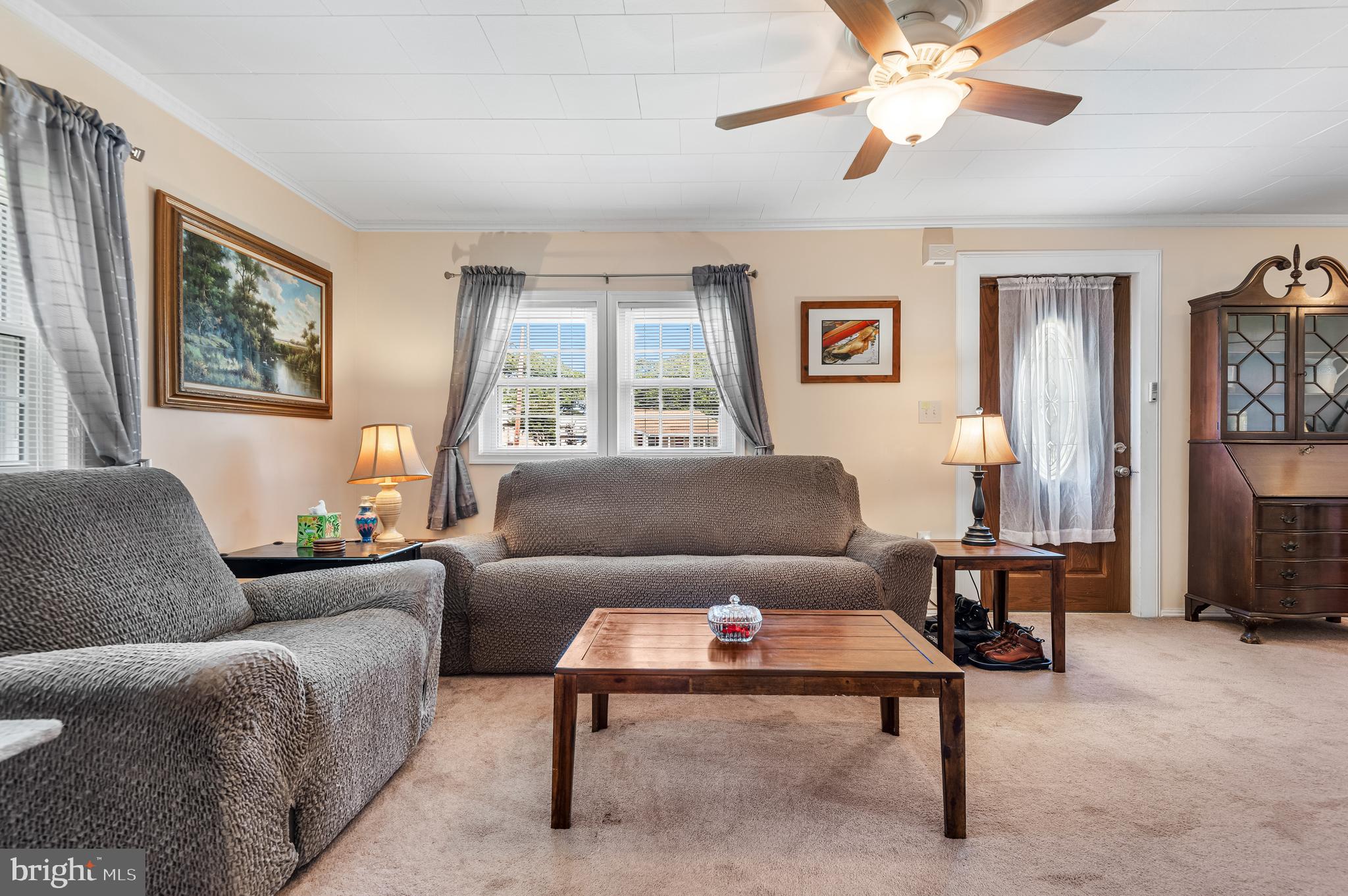 111 Compass Road Baltimore, MD 21220 - Photo 9 of 36 a living room with furniture and a window
