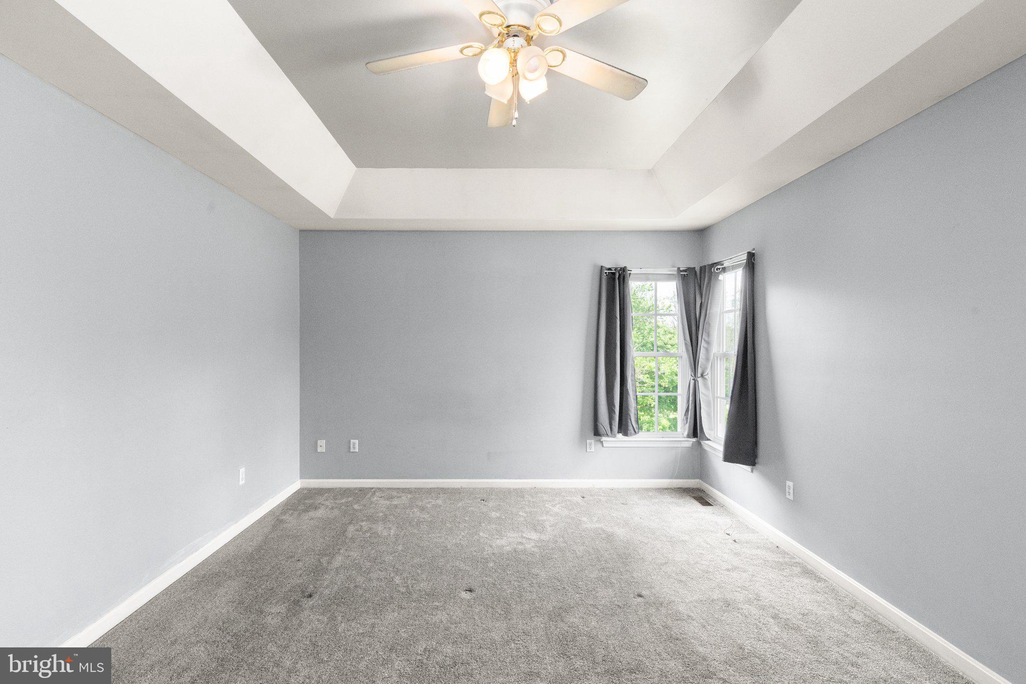 40 Stubb Road Rising Sun, MD 21911 - Photo 12 of 39 an empty room with windows and chandelier fan
