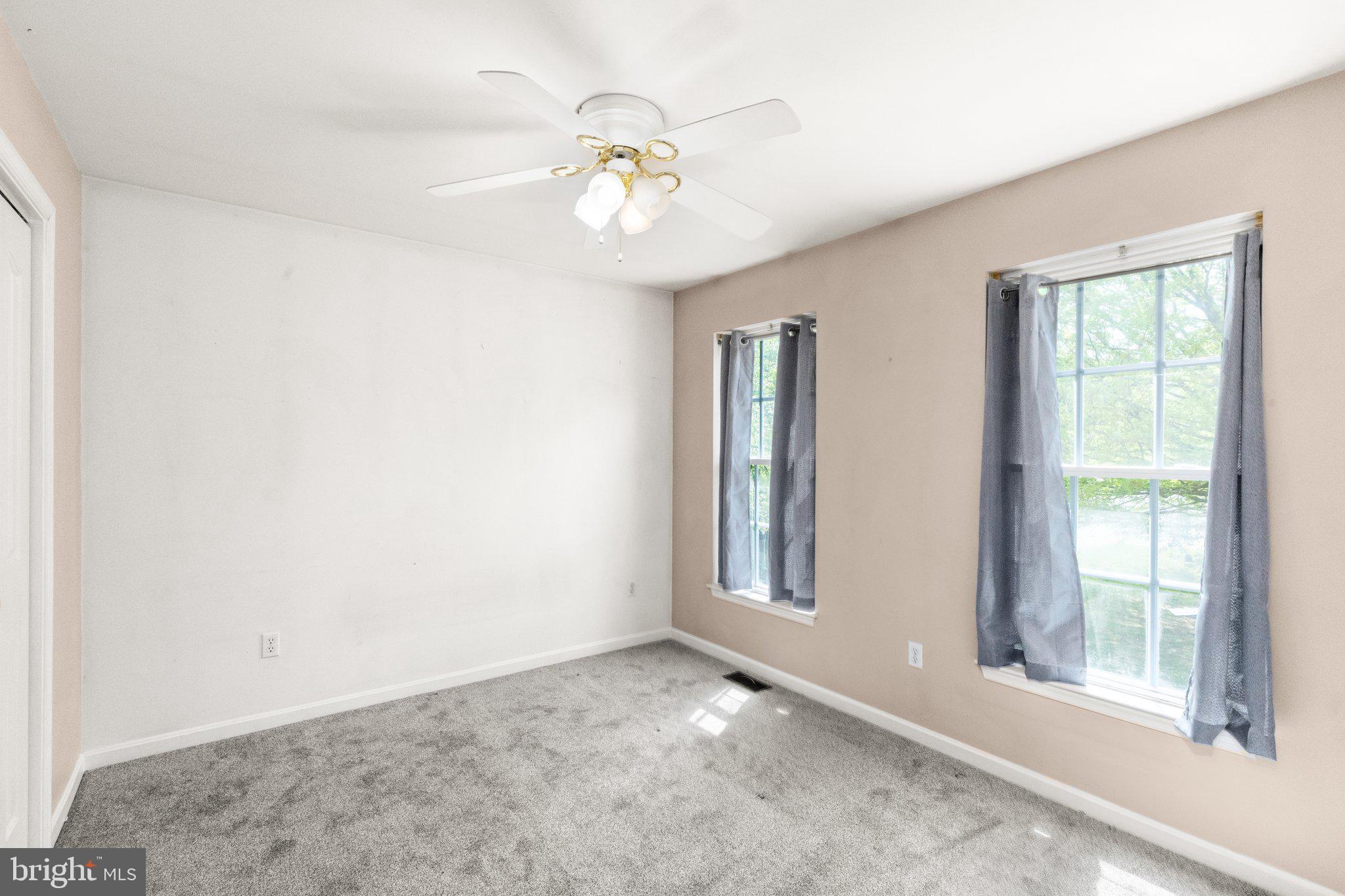 40 Stubb Road Rising Sun, MD 21911 - Photo 18 of 39 an empty room with windows and chandelier fan