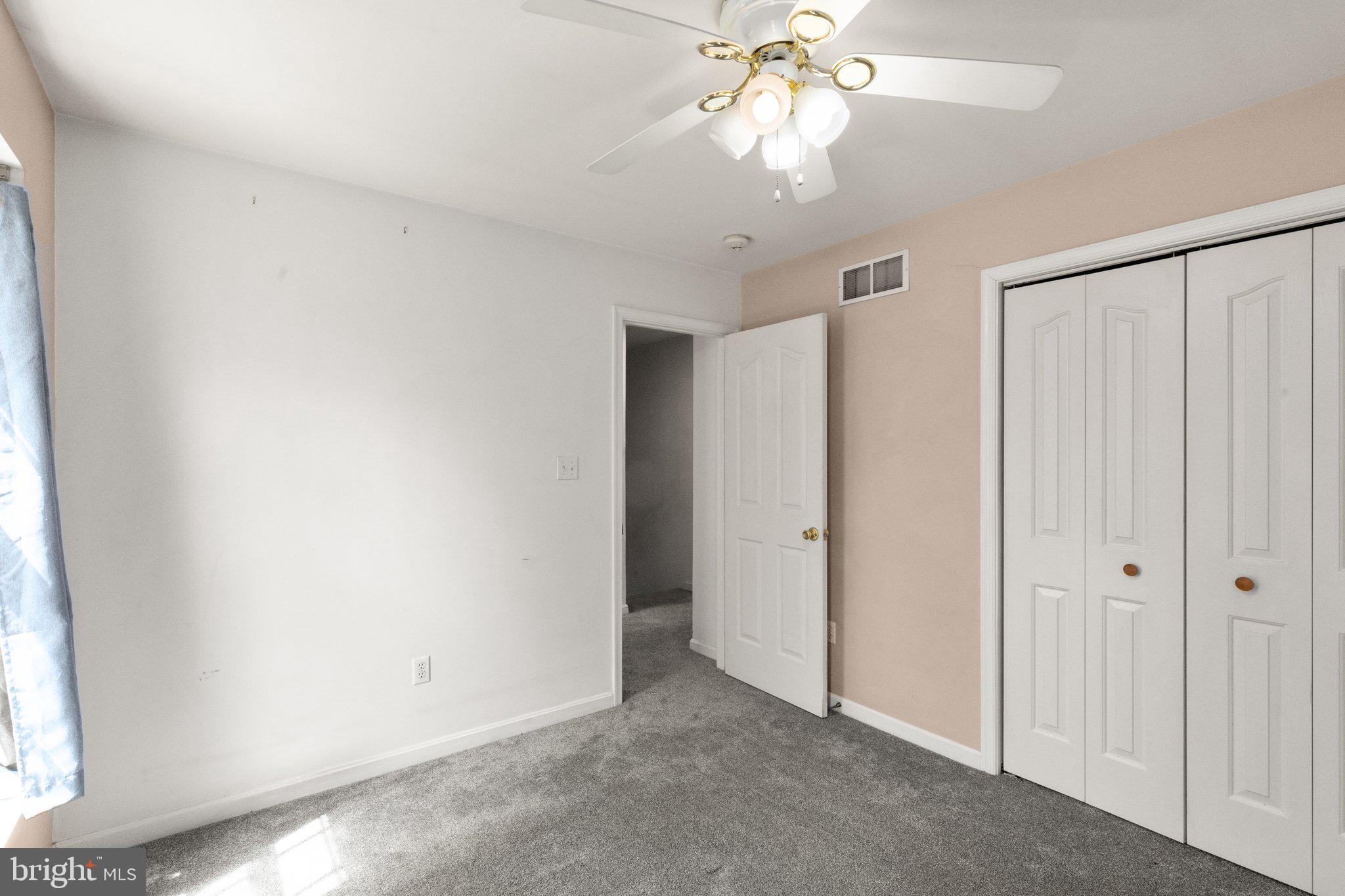 40 Stubb Road Rising Sun, MD 21911 - Photo 19 of 39 an empty room with a ceiling fan and a window